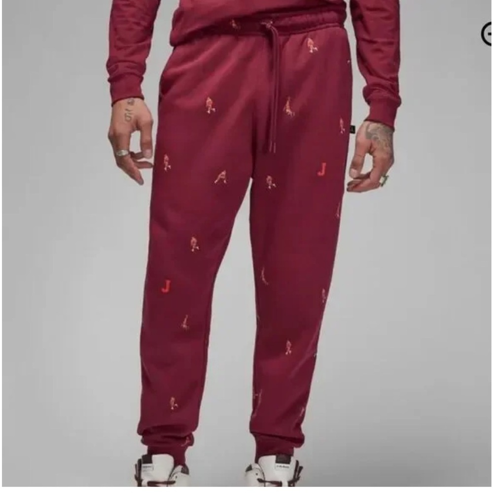 Nike Air Jordan MJ Essentials All-Over Print Pants Cherrywood Red colorway